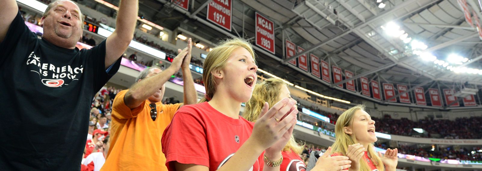 Sports fans enjoying Carolina Hurricanes hockey game