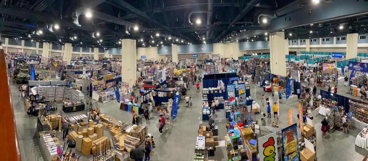 A large exhibit hall full of vendors and attendees at Galaxycon in Raleigh at the Raleigh Convention Center